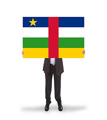 Image showing Businessman holding a big card, flag of CAR