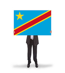 Image showing Businessman holding a big card, flag of Congo