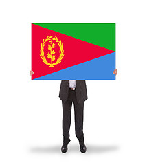 Image showing Businessman holding a big card, flag of Eritrea