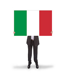 Image showing Businessman holding a big card, flag of Italy