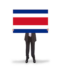 Image showing Businessman holding a big card, flag of Costa RIca