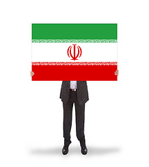 Image showing Businessman holding a big card, flag of Iran