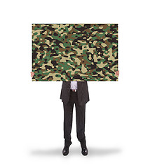 Image showing Businessman holding a big card, camouflage 