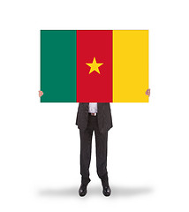 Image showing Businessman holding a big card, flag of Cameroon