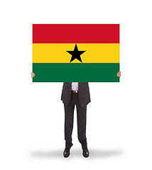 Image showing Businessman holding a big card, flag of Ghana