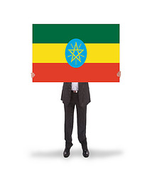 Image showing Businessman holding a big card, flag of Ethiopia