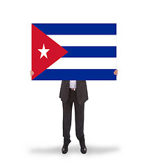Image showing Businessman holding a big card, flag of Cuba