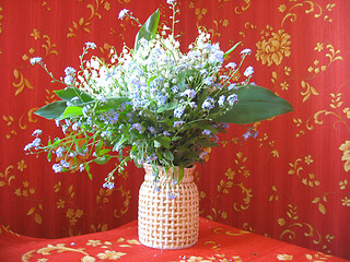 Image showing bouquet of lilies of the valley and blue flowers