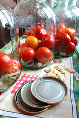 Image showing tomatos in jars prepared for preservation