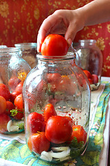 Image showing tomatos in jars prepared for preservation