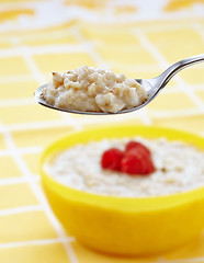 Image showing Spoon of oats porridge