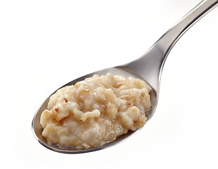 Image showing Spoon of oats porridge