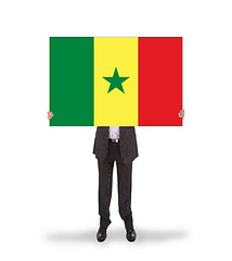 Image showing Businessman holding a big card, flag of Senegal