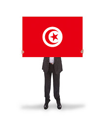 Image showing Businessman holding a big card, flag of Tunisia