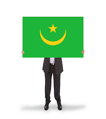 Image showing Businessman holding a big card, flag of Mauritania