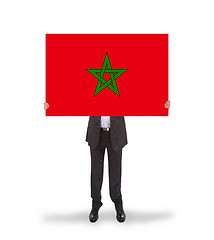 Image showing Businessman holding a big card, flag of Morocco