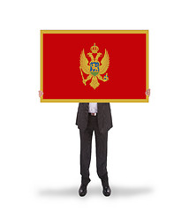 Image showing Businessman holding a big card, flag of Montenegro