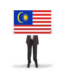 Image showing Businessman holding a big card, flag of Malaysia