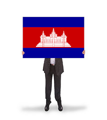 Image showing Businessman holding a big card, flag of Cambodia