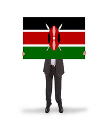 Image showing Businessman holding a big card, flag of Kenya