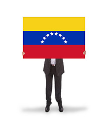Image showing Businessman holding a big card, flag of Venezuela
