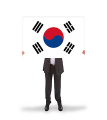 Image showing Businessman holding a big card, flag of South Korea