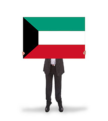 Image showing Businessman holding a big card, flag of Kuwait