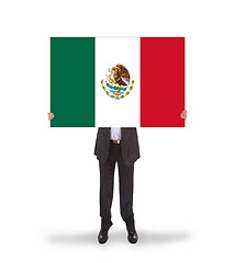 Image showing Businessman holding a big card, flag of Mexico