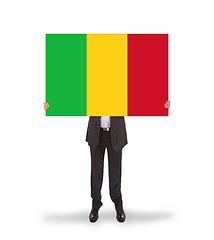 Image showing Businessman holding a big card, flag of Mali