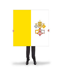 Image showing Businessman holding a big card, flag of Vatican City