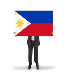 Image showing Businessman holding a big card, flag of Philippines