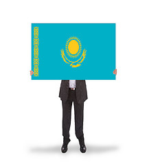 Image showing Businessman holding a big card, flag of Kazakhstan