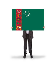 Image showing Businessman holding a big card, flag of Turkmenistan