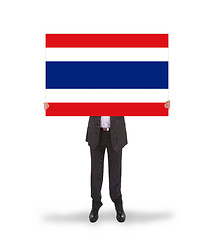 Image showing Businessman holding a big card, flag of Thailand