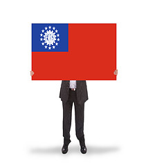 Image showing Businessman holding a big card, flag of Myanmar