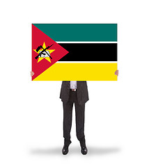 Image showing Businessman holding a big card, flag of Mozambique