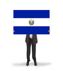 Image showing Businessman holding a big card, flag of El Salvador