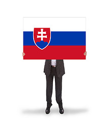 Image showing Businessman holding a big card, flag of Slovakia