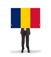 Image showing Businessman holding a big card, flag of Romania