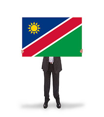 Image showing Businessman holding a big card, flag of Namibia