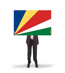 Image showing Businessman holding a big card, flag of Seychelles