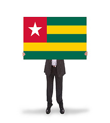 Image showing Businessman holding a big card, flag of Togo