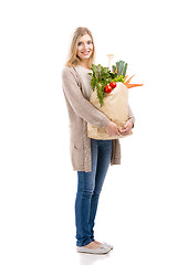 Image showing Beautiful woman carrying vegetables