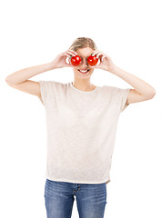 Image showing Beaitiful woman with tomatos in front of the face