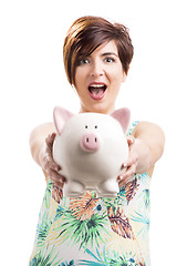 Image showing Beautiful woman showing a piggybank