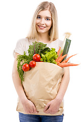 Image showing Beautiful woman carrying vegetables