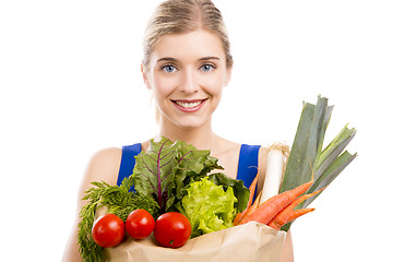 Image showing Beautiful woman carrying vegetables