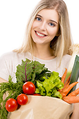 Image showing Beautiful woman carrying vegetables