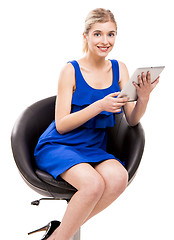 Image showing Woman working with a tablet