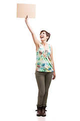 Image showing Happy woman holding with a cardboard